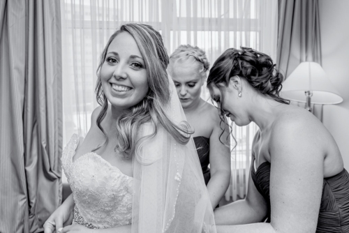 Wedding Portfolio A bride with bridesmaids getting ready during bridal prep for a Juno Tower wedding.