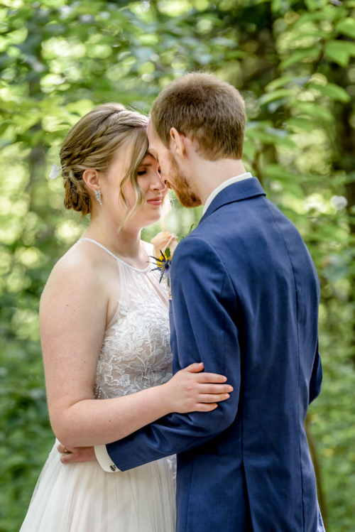 Bride and groom embrace during their wedding photos at Sir Sandford Fleming Park in Halifax, NS.