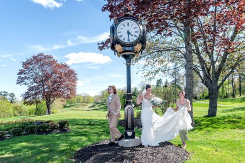The bride and groom preparing for their wedding photos during their wedding at the Ashburn Golf Club in Halifax.